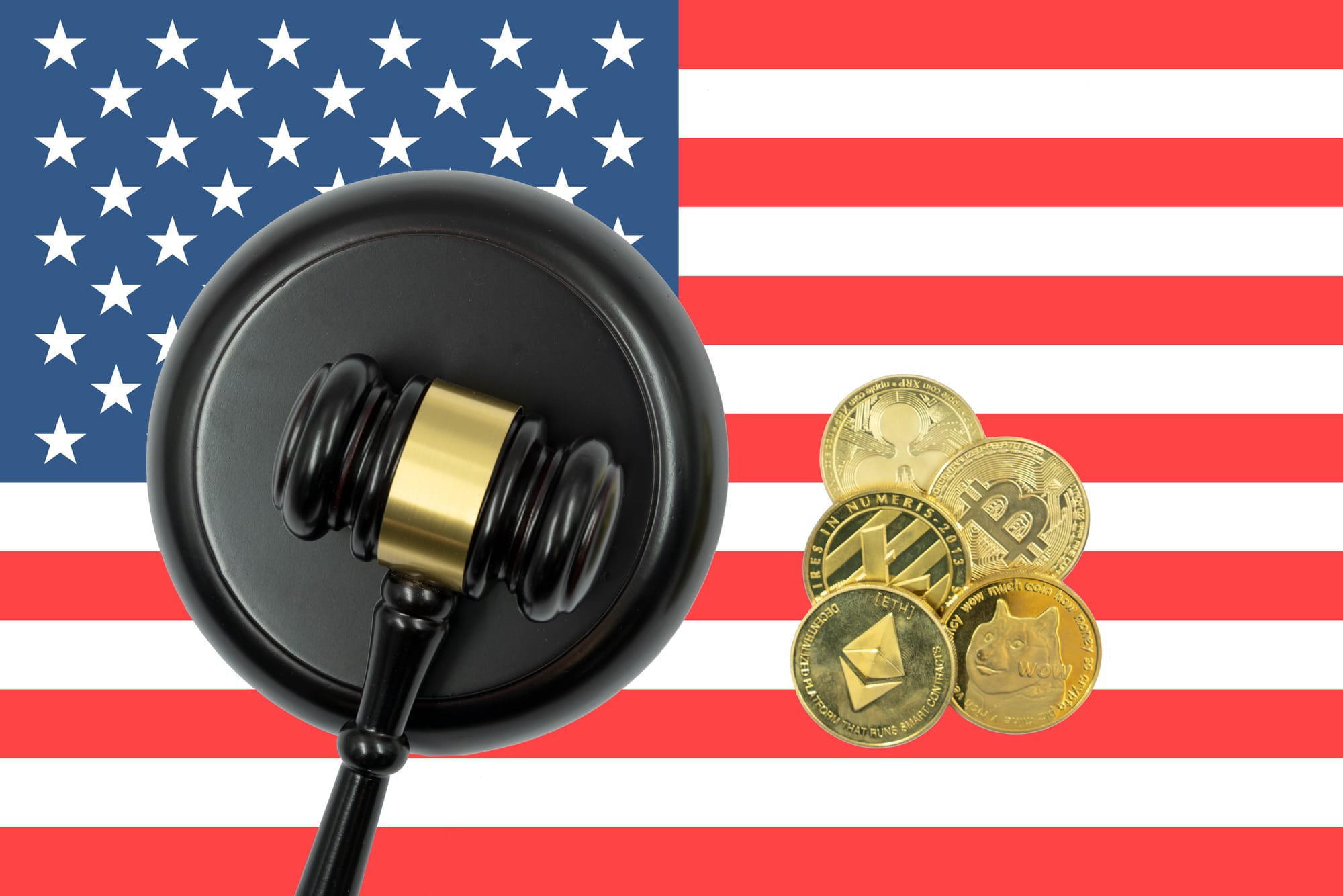 American flag with judge's gavel and crypto coins on atop